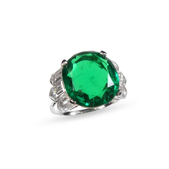 Single stone emerald and diamond ring